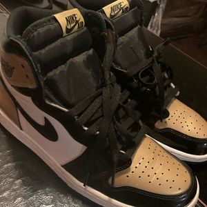 Authentic Air Jordan 1 Retro High gold toe.